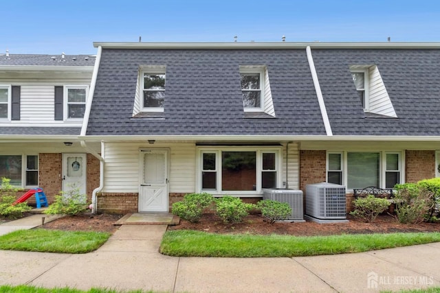 7 Tisbury Ct, Scotch Plains, NJ 07076 - view of front of home with brick siding, roof with shingles, covered porch, and mansard roof