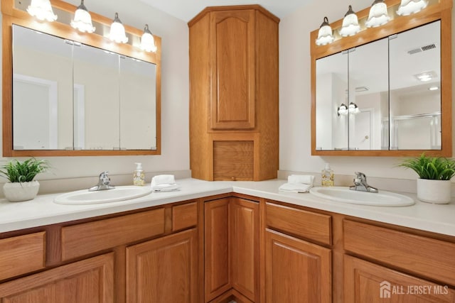 7 Tisbury Ct, Scotch Plains, NJ 07076 - full bathroom featuring double vanity and a shower with door