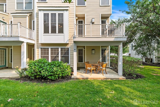 19 S Shore Dr, South Amboy, NJ 08879 - back of house featuring a balcony, a lawn, and a patio area