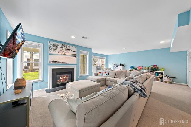 19 S Shore Dr, South Amboy, NJ 08879 - living area with carpet, a fireplace with flush hearth, plenty of natural light, baseboards, and recessed lighting
