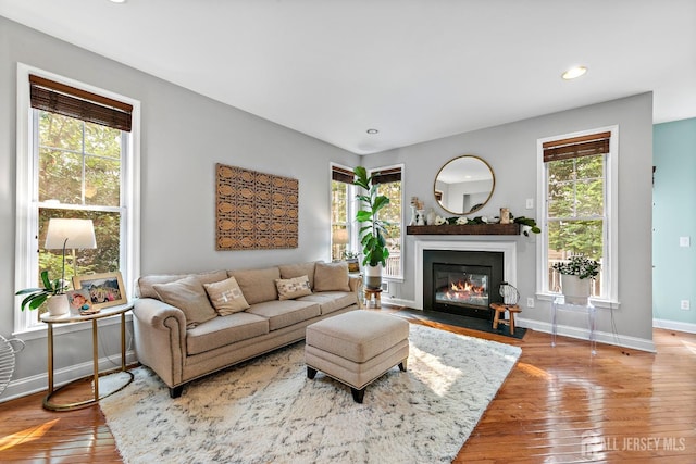 19 S Shore Dr, South Amboy, NJ 08879 - living area with baseboards, a fireplace with flush hearth, wood-type flooring, and recessed lighting
