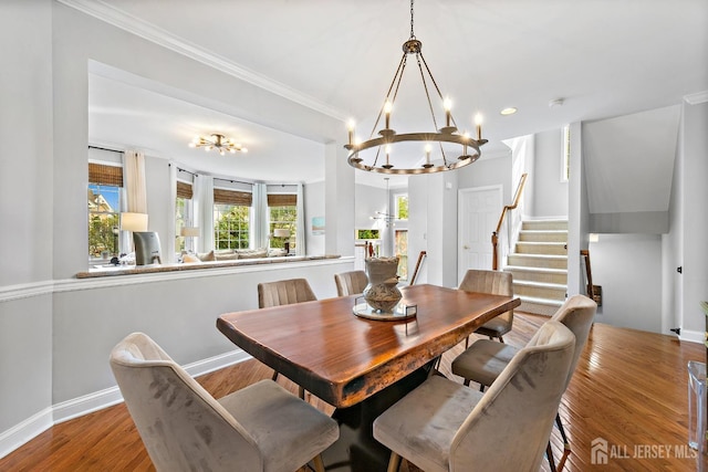 19 S Shore Dr, South Amboy, NJ 08879 - dining room featuring a chandelier, stairway, baseboards, wood finished floors, and crown molding