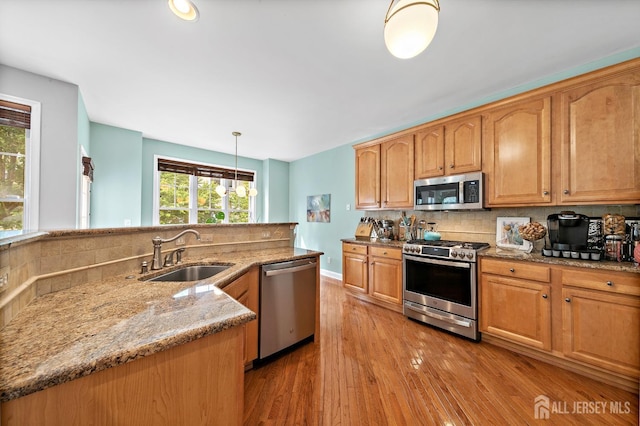 19 S Shore Dr, South Amboy, NJ 08879 - kitchen featuring stainless steel appliances, a sink, tasteful backsplash, and light stone counters