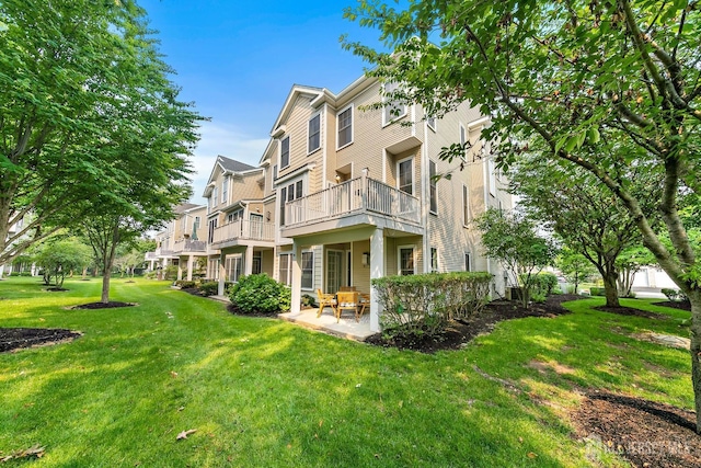 19 S Shore Dr, South Amboy, NJ 08879 - back of house with a lawn, a balcony, and a patio area
