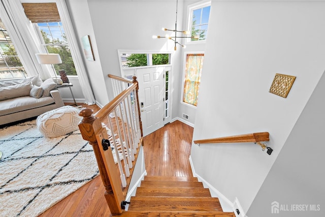 19 S Shore Dr, South Amboy, NJ 08879 - foyer entrance with a chandelier, hardwood / wood-style floors, baseboards, and stairway