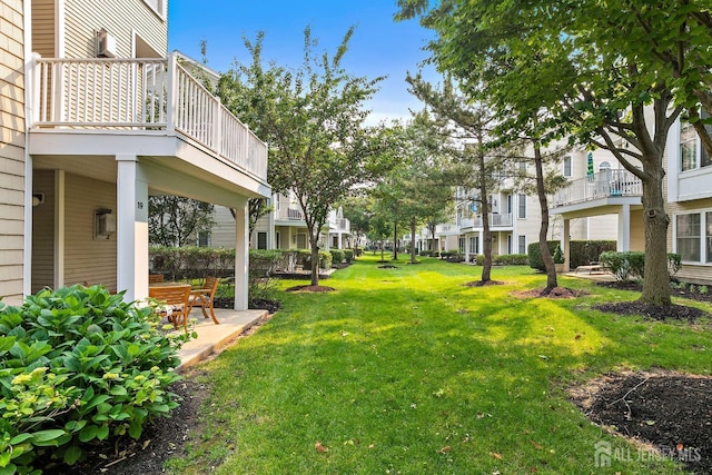 19 S Shore Dr, South Amboy, NJ 08879 - view of green lawn with a balcony, a residential view, and a patio