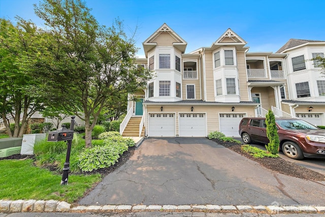 19 S Shore Dr, South Amboy, NJ 08879 - multi unit property with asphalt driveway, an attached garage, and stairway