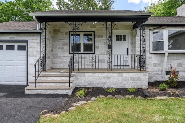 144 Elm St, Dover, NJ 07801 - view of front of property with stone siding, a porch, a garage, and roof with shingles