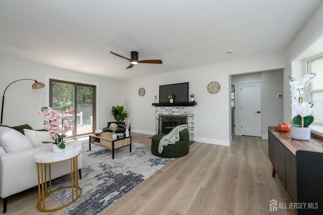 144 Elm St, Dover, NJ 07801 - living area featuring wood finished floors, a fireplace, and ceiling fan