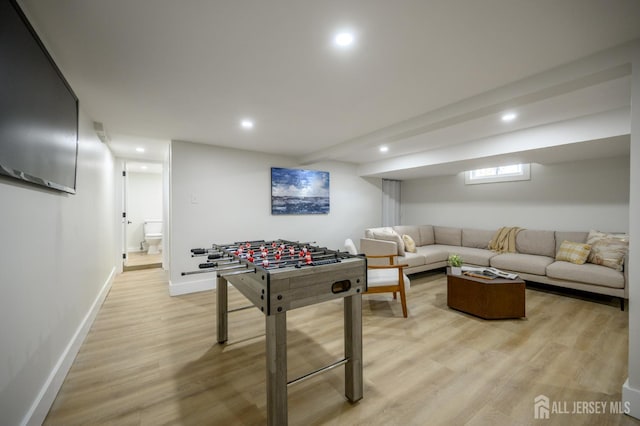144 Elm St, Dover, NJ 07801 - recreation room with light wood-style flooring and recessed lighting