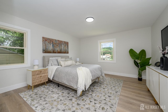 144 Elm St, Dover, NJ 07801 - bedroom featuring light wood finished floors and baseboards