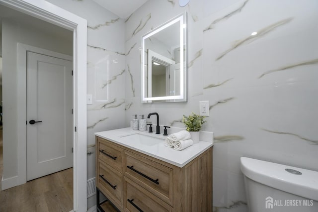 144 Elm St, Dover, NJ 07801 - bathroom with vanity and wood finished floors