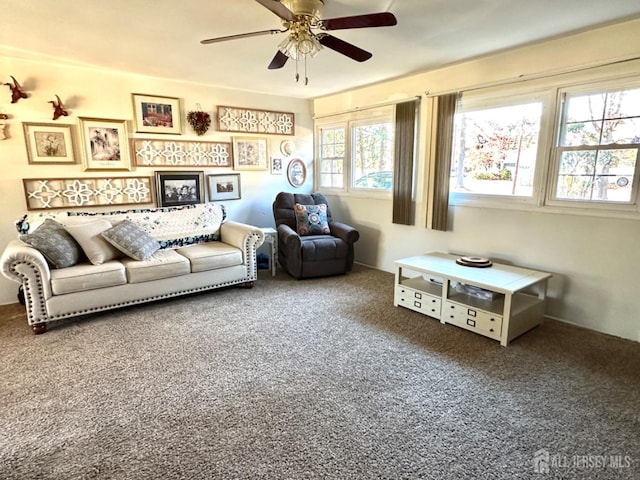 living room featuring carpet flooring, plenty of natural light, and ceiling fan