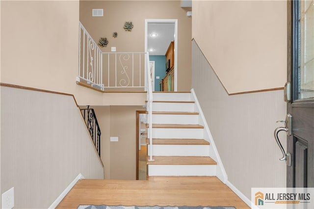 staircase with wood finished floors