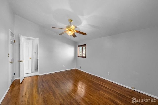 empty room with ceiling fan, baseboards, and wood finished floors