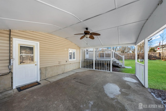 view of patio / terrace featuring ceiling fan and fence