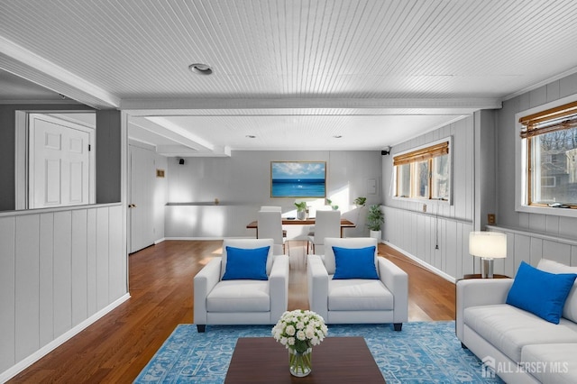 living room with wood finished floors and baseboards