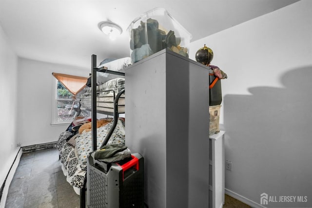 utility room featuring baseboard heating