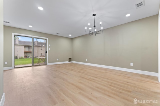 13 Stuart Dr Unit 5, Freehold, NJ 07728 - spare room featuring light wood-type flooring, recessed lighting, and a chandelier