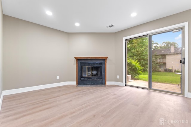 13 Stuart Dr Unit 5, Freehold, NJ 07728 - unfurnished living room with light wood-type flooring, recessed lighting, and a fireplace with flush hearth
