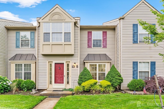 13 Stuart Dr Unit 5, Freehold, NJ 07728 - townhome / multi-family property featuring a standing seam roof and a front yard