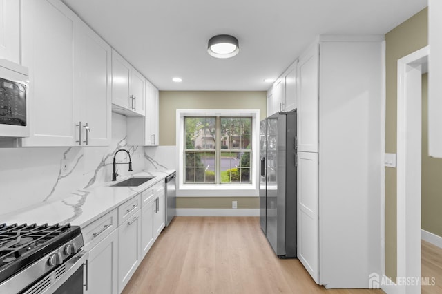 13 Stuart Dr Unit 5, Freehold, NJ 07728 - kitchen featuring appliances with stainless steel finishes, light wood-style flooring, white cabinetry, and recessed lighting