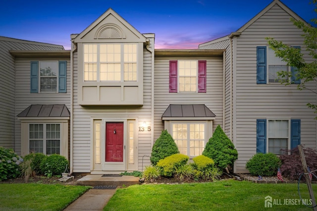 13 Stuart Dr Unit 5, Freehold, NJ 07728 - townhome / multi-family property with a standing seam roof, a lawn, and a metal roof