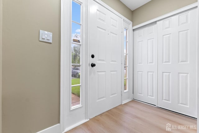 13 Stuart Dr Unit 5, Freehold, NJ 07728 - entrance foyer with healthy amount of natural light and light wood-style flooring