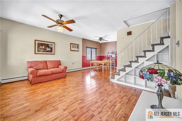 146 Arlington Dr, Fords, NJ 08863 - living room featuring a ceiling fan, light wood-style flooring, a baseboard heating unit, baseboard heating, and stairs