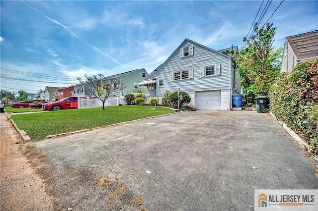 146 Arlington Dr, Fords, NJ 08863 - view of front of house with asphalt driveway, a garage, and a front lawn