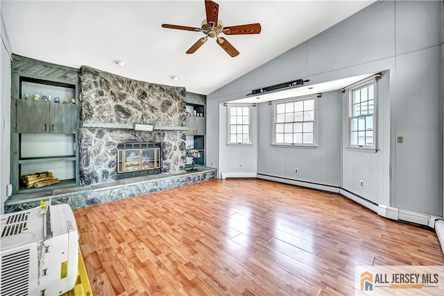 146 Arlington Dr, Fords, NJ 08863 - unfurnished living room with lofted ceiling, plenty of natural light, ceiling fan, wood finished floors, and a fireplace
