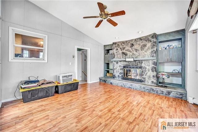 146 Arlington Dr, Fords, NJ 08863 - living area with vaulted ceiling, wood finished floors, ceiling fan, a stone fireplace, and baseboards
