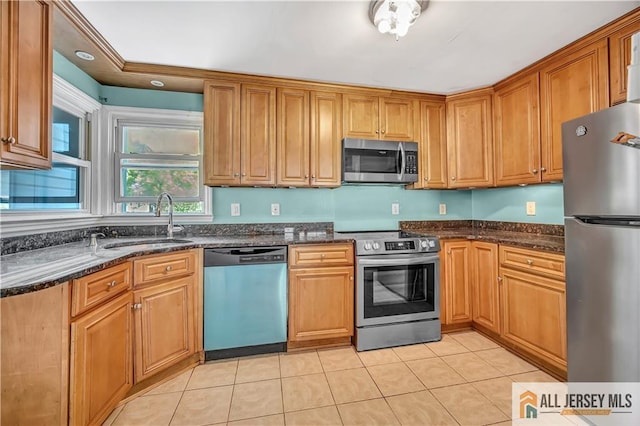 146 Arlington Dr, Fords, NJ 08863 - kitchen featuring stainless steel appliances, a sink, light tile patterned flooring, and dark stone counters