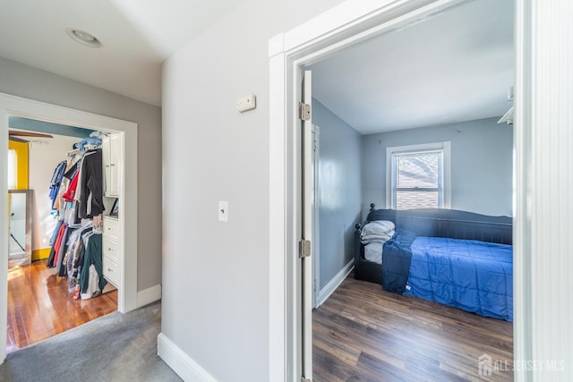 292 Morton Ave, Rahway, NJ 07065 - bedroom with baseboards, wood finished floors, and a walk in closet