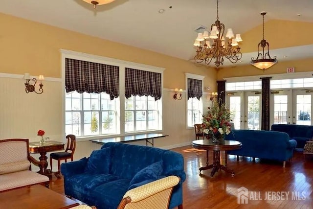 116 Prusakowski Blvd, Sayreville, NJ 08859 - living area featuring a notable chandelier, a wealth of natural light, french doors, and wood finished floors