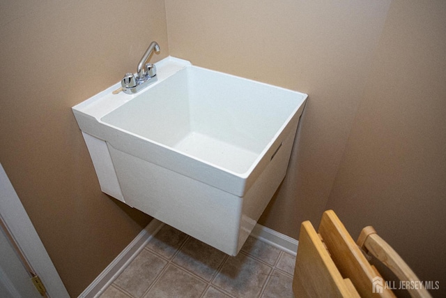 116 Prusakowski Blvd, Sayreville, NJ 08859 - clothes washing area with baseboards, tile patterned floors, and a sink