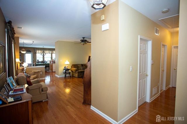 116 Prusakowski Blvd, Sayreville, NJ 08859 - hall featuring visible vents, wood finished floors, and attic access