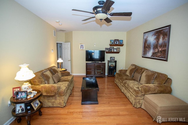 116 Prusakowski Blvd, Sayreville, NJ 08859 - living room featuring baseboards, a ceiling fan, and light wood-style flooring