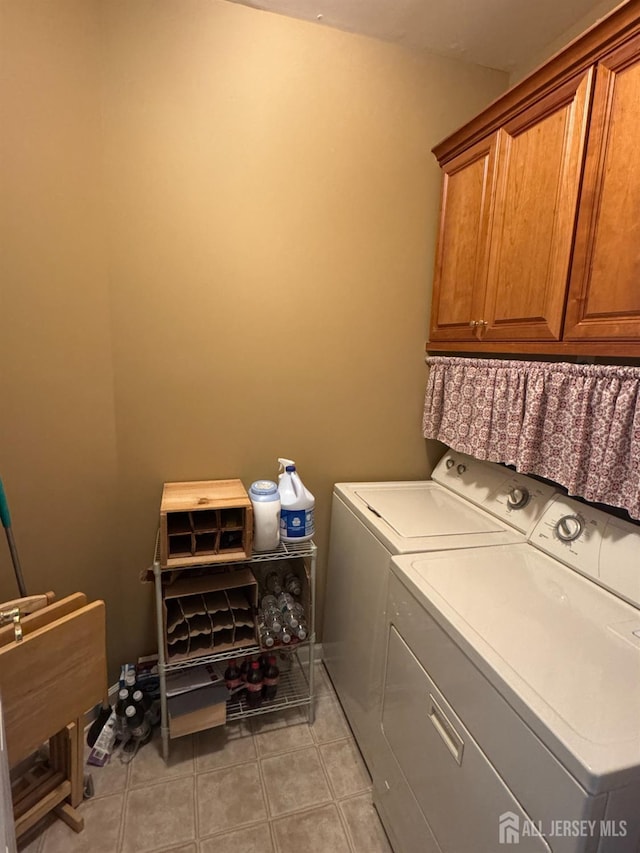 116 Prusakowski Blvd, Sayreville, NJ 08859 - clothes washing area with light tile patterned flooring, cabinet space, and washer and clothes dryer