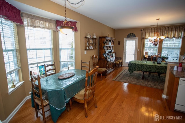 116 Prusakowski Blvd, Sayreville, NJ 08859 - dining space with light wood-style floors, a wealth of natural light, and a chandelier