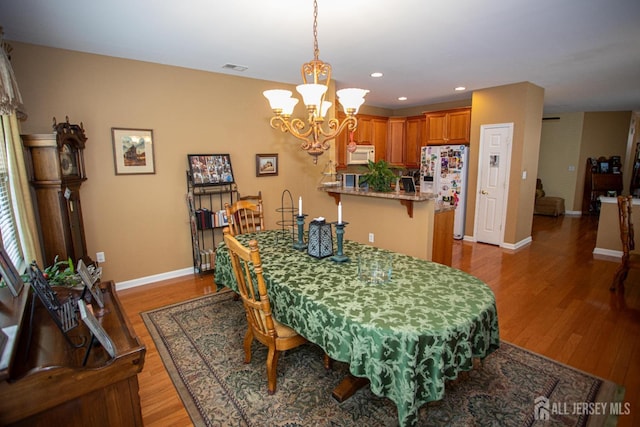 116 Prusakowski Blvd, Sayreville, NJ 08859 - dining area with baseboards, recessed lighting, wood finished floors, and a notable chandelier