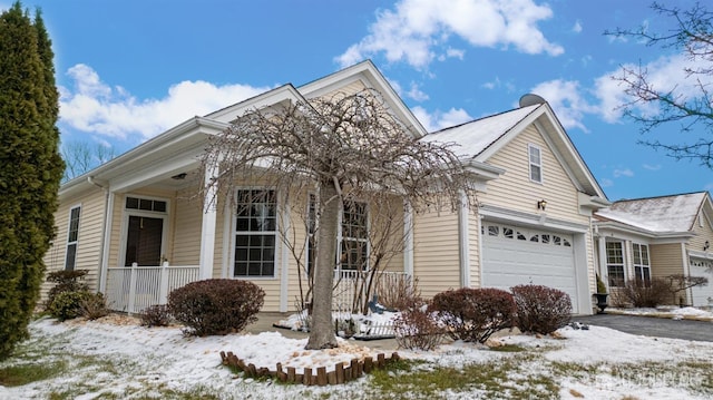 view of front facade featuring a garage and a porch