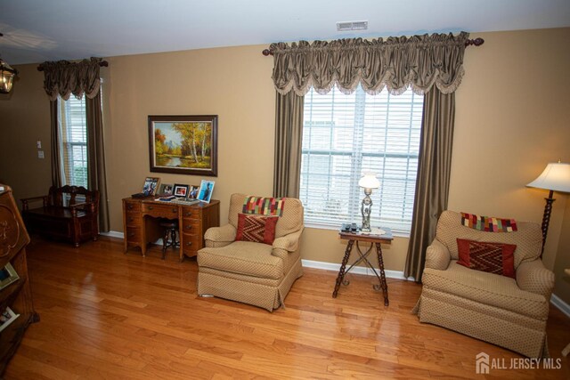 116 Prusakowski Blvd, Sayreville, NJ 08859 - living area with visible vents, baseboards, and light wood-type flooring