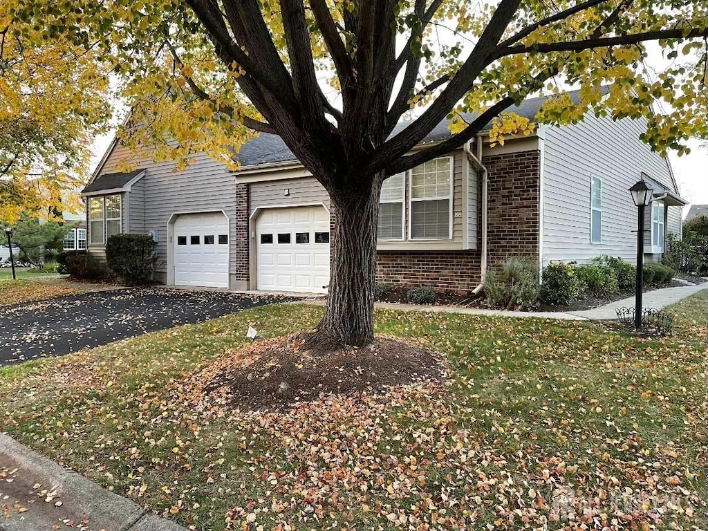 view of side of home with a garage