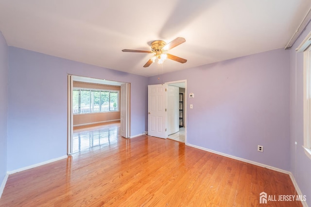 289 Old Rd, Sewaren, NJ 07077 - empty room with a ceiling fan, baseboards, and light wood-type flooring