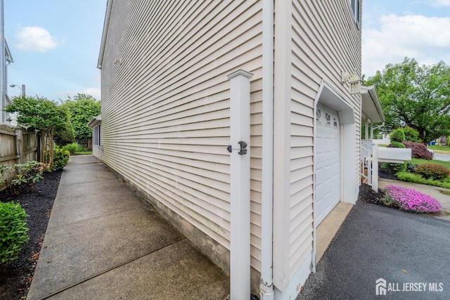 289 Old Rd, Sewaren, NJ 07077 - view of property exterior featuring driveway and an attached garage