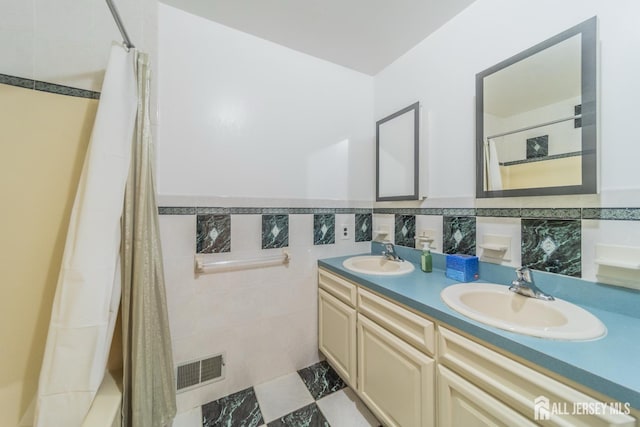289 Old Rd, Sewaren, NJ 07077 - bathroom featuring double vanity and shower / bath combo