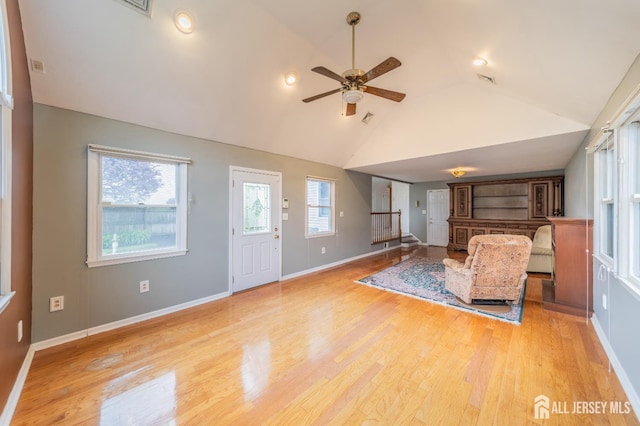 289 Old Rd, Sewaren, NJ 07077 - unfurnished living room featuring a ceiling fan, wood finished floors, lofted ceiling, and baseboards