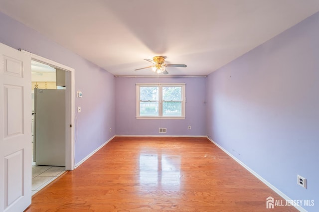 289 Old Rd, Sewaren, NJ 07077 - spare room featuring a ceiling fan, light wood-style floors, and baseboards