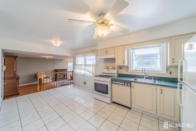 289 Old Rd, Sewaren, NJ 07077 - kitchen featuring white appliances, a sink, under cabinet range hood, ceiling fan, and dark countertops